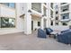 Large, covered patio with outdoor seating and views of the surrounding buildings at 2511 W Queen Creek Rd # 165, Chandler, AZ 85248