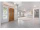 Welcoming foyer featuring tile flooring, shutters, and entry to the formal living spaces at 2528 N Ashbrook Cir, Mesa, AZ 85213
