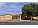 Charming single story home with well-manicured front yard and three car garage at 2528 N Ashbrook Cir, Mesa, AZ 85213