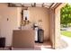 Garage interior showcasing hot water heater and water softener system at 2528 N Ashbrook Cir, Mesa, AZ 85213