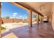 Covered patio featuring decorative concrete, ceiling fans, and a view of the water feature at 2528 N Ashbrook Cir, Mesa, AZ 85213