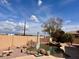 Backyard oasis featuring a sparkling pool with a rock waterfall feature and lush landscaping for privacy at 2528 N Ashbrook Cir, Mesa, AZ 85213