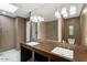 Modern bathroom with double sinks, sleek countertops, and stylish tile work throughout at 33 W Missouri Ave # 17, Phoenix, AZ 85013