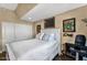 Cozy bedroom with a white bed, closet and unique art at 33 W Missouri Ave # 17, Phoenix, AZ 85013