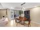 Cozy dining area with an oval table, chairs, and cabinet sits adjacent to the living area at 33 W Missouri Ave # 17, Phoenix, AZ 85013
