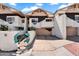 Beautiful exterior view showcasing the home's garage, entry gate, and architectural design at 33 W Missouri Ave # 17, Phoenix, AZ 85013