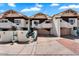 Modern townhome with unique architectural details, desert landscaping, and convenient garage access at 33 W Missouri Ave # 17, Phoenix, AZ 85013