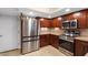 Well-equipped kitchen featuring stainless steel appliances and beautiful wood cabinets at 33 W Missouri Ave # 17, Phoenix, AZ 85013