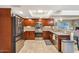 Spacious kitchen showcasing stainless steel appliances and tile flooring at 33 W Missouri Ave # 17, Phoenix, AZ 85013