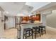 Updated kitchen features granite countertops, stainless steel appliances, bar seating and tile flooring at 33 W Missouri Ave # 17, Phoenix, AZ 85013