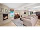 Comfortable living room features a cozy fireplace, patterned rug, and stylish furnishings at 33 W Missouri Ave # 17, Phoenix, AZ 85013