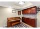 Living space featuring a piano, dark wood cabinets and neutral decor at 33 W Missouri Ave # 17, Phoenix, AZ 85013