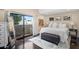 Inviting main bedroom with a large bed, accent seating, a balcony, and plenty of natural light at 33 W Missouri Ave # 17, Phoenix, AZ 85013