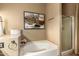 Modern bathroom with a soaking tub, glass shower, and decorative accents at 3308 N Nebraska St, Chandler, AZ 85225