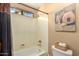 Classic bathroom with a tub-shower combo, toilet, and decorative art at 3308 N Nebraska St, Chandler, AZ 85225