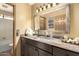 Bathroom vanity with a dark brown cabinet and a framed mirror at 3308 N Nebraska St, Chandler, AZ 85225