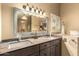 Well-lit bathroom featuring a double vanity, framed mirror, and stylish fixtures at 3308 N Nebraska St, Chandler, AZ 85225
