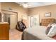 Comfortable bedroom with a ceiling fan and access to a screened-in patio at 3308 N Nebraska St, Chandler, AZ 85225