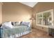 This bedroom features a daybed, window with shutters, tile floors, and neutral paint at 3308 N Nebraska St, Chandler, AZ 85225