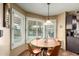 Breakfast nook with backyard views, featuring a round table, chairs and plantation shutters at 3308 N Nebraska St, Chandler, AZ 85225
