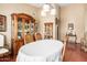 Elegant dining room featuring a large wooden china cabinet, table and chairs at 3308 N Nebraska St, Chandler, AZ 85225