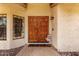 Close-up of a double-door entryway with sidelight windows and a welcome mat at the front door at 3308 N Nebraska St, Chandler, AZ 85225