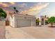 Exterior view of home showing a desert rock front yard and two car garage on a sunny day at 3308 N Nebraska St, Chandler, AZ 85225