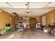 This is a spacious garage with shelving, ladder, storage space, and tools at 3308 N Nebraska St, Chandler, AZ 85225