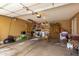 This is a spacious garage with shelving, ladder, storage space, and tools at 3308 N Nebraska St, Chandler, AZ 85225