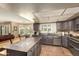 Modern kitchen with an island, stainless steel appliances, and wood cabinets at 3308 N Nebraska St, Chandler, AZ 85225