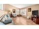 Comfortable living room featuring tile floors, neutral colors, and plantation shutters for natural light at 3308 N Nebraska St, Chandler, AZ 85225