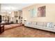 Spacious living room showcasing tile floors, neutral paint, and open access to dining area at 3308 N Nebraska St, Chandler, AZ 85225