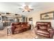 Open-concept living room area with comfortable leather furniture and kitchen views at 3308 N Nebraska St, Chandler, AZ 85225