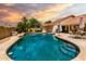 Beautiful pool and patio area with palm trees creating a tropical and serene backyard setting at 3308 N Nebraska St, Chandler, AZ 85225