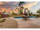 Backyard with a refreshing pool, patio furniture, and privacy landscaping under a beautiful sky at 3308 N Nebraska St, Chandler, AZ 85225