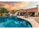Sparkling swimming pool with a patio area for entertaining and lush backyard views at 3308 N Nebraska St, Chandler, AZ 85225