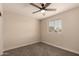 Cozy bedroom featuring a ceiling fan and natural light from the window at 3502 W Gardenia Ave, Phoenix, AZ 85051