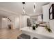 A bright kitchen features white cabinets, quartz countertops, and stainless steel appliances at 3502 W Gardenia Ave, Phoenix, AZ 85051