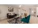 Cozy living room with a ceiling fan and comfortable seating arrangement at 3502 W Gardenia Ave, Phoenix, AZ 85051