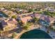Gorgeous aerial view of the property with landscaping, lake, and community at 3750 E Sawtooth Dr, Chandler, AZ 85249