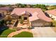 Aerial view of a home with a three-car garage, landscaped yard, and a well-maintained roof at 3750 E Sawtooth Dr, Chandler, AZ 85249