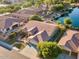 Expansive aerial shot showcases the home's private yard, serene lake, and a beautiful neighborhood at 3750 E Sawtooth Dr, Chandler, AZ 85249