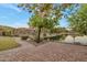 Brick-paved walkway to the backyard offering a pond with a secure wrought iron fence at 3750 E Sawtooth Dr, Chandler, AZ 85249