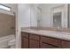 Bathroom featuring double sinks, granite countertops, and a tile shower with a tub at 3750 E Sawtooth Dr, Chandler, AZ 85249