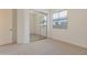 Bedroom with mirrored closet doors, neutral carpet and natural light from window at 3750 E Sawtooth Dr, Chandler, AZ 85249