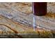 Close-up of a decorative granite countertop featuring a blend of brown, grey, and white hues at 3750 E Sawtooth Dr, Chandler, AZ 85249