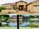 Charming single-story home with stone accents, a tile roof, and a well-manicured front yard at 3750 E Sawtooth Dr, Chandler, AZ 85249