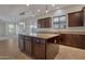 View of kitchen island with granite countertop, stainless steel appliances and pendant lighting at 3750 E Sawtooth Dr, Chandler, AZ 85249