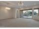 Open living room with large windows and modern chandeliers at 3750 E Sawtooth Dr, Chandler, AZ 85249