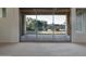 Spacious living room features sliding glass doors with lake views at 3750 E Sawtooth Dr, Chandler, AZ 85249